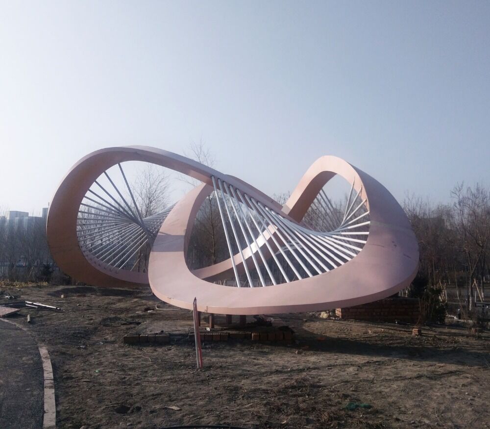Large stainless steel sculptures in park square