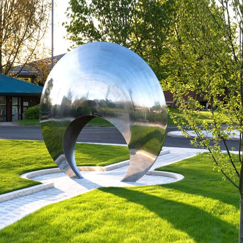 large abstract stainless steel outdoor sculpture space time tunnel sculpture
