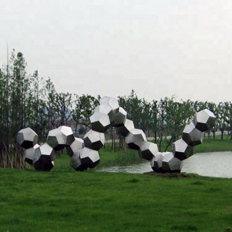 Modern abstract stainless steel polished stone snake