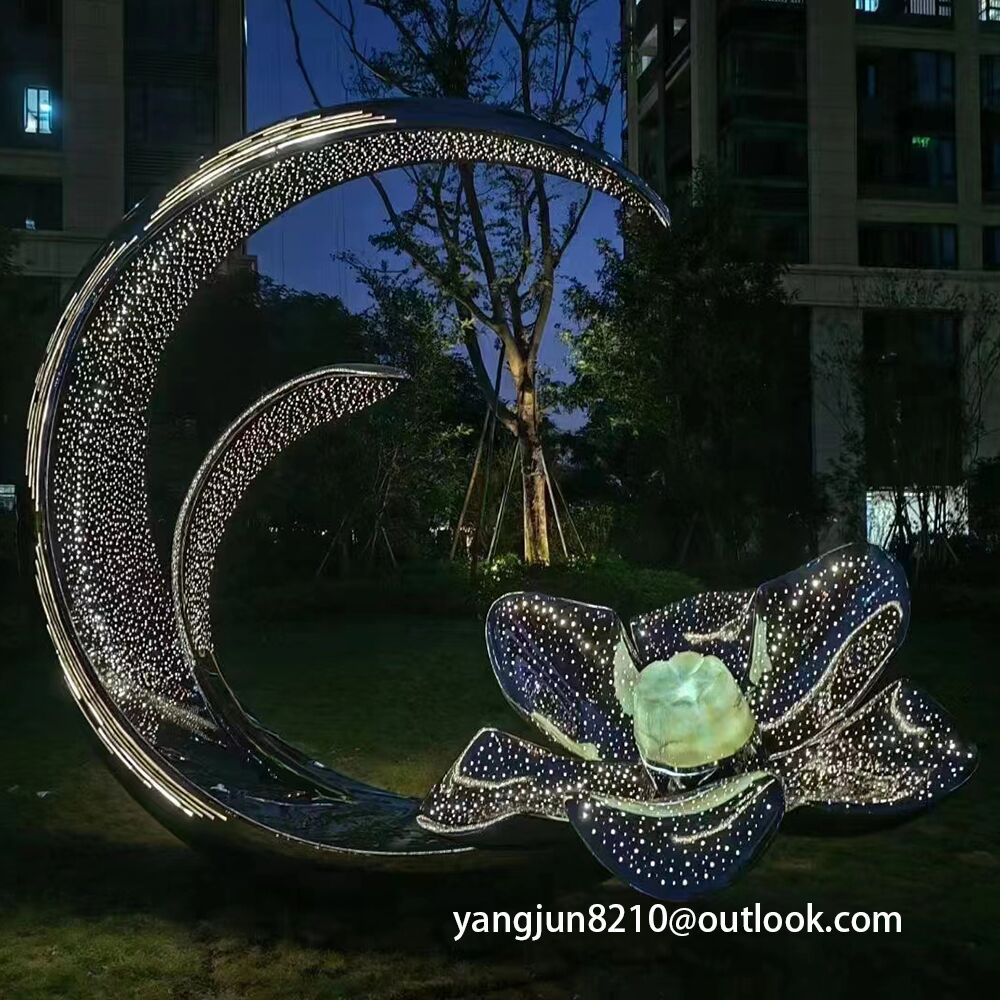 Large outdoor park square apartment playground theatre glowing stainless steel crescent sculpture (1)